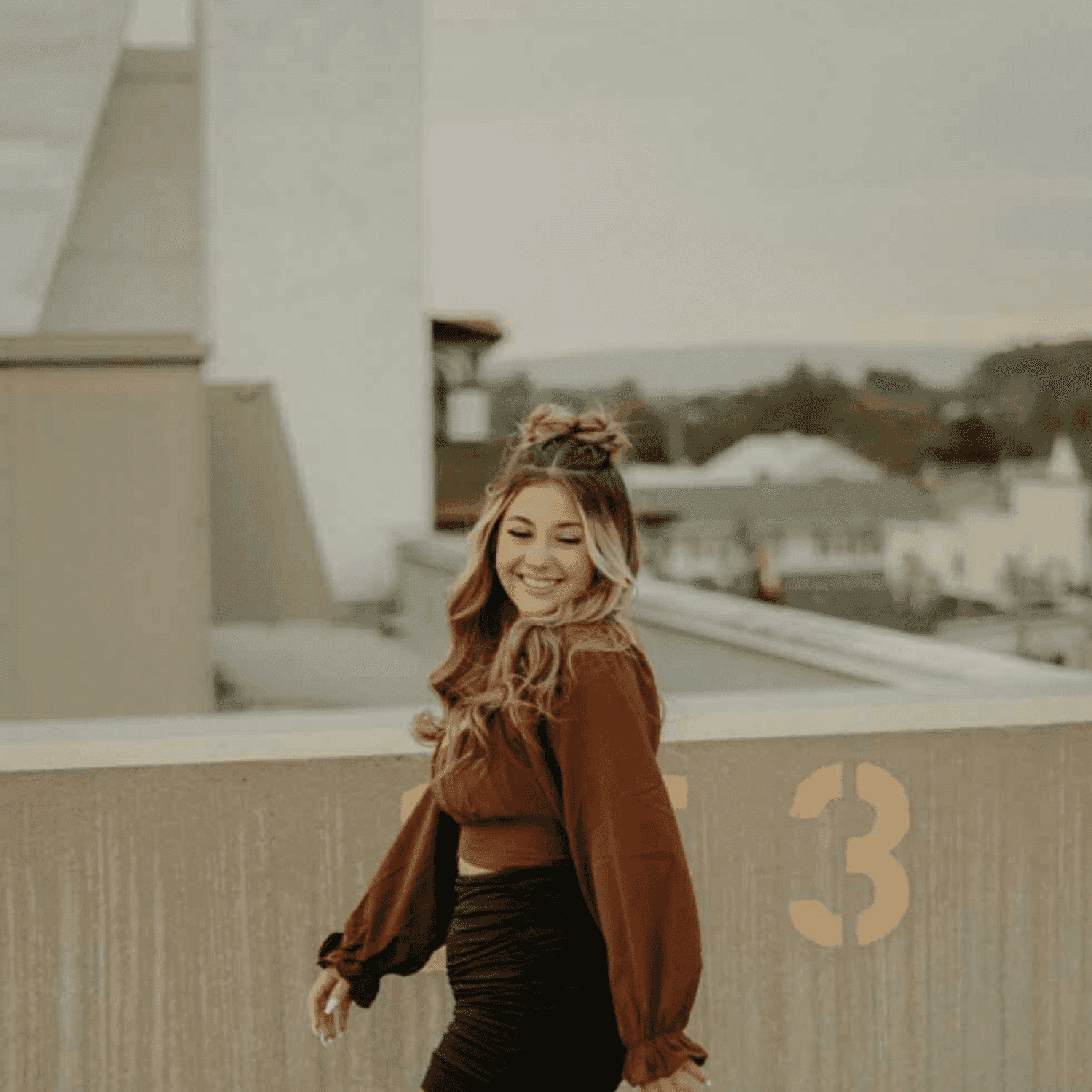 Portrait of Cameryn, a professional stylist at Meraki Salon & Spa, showcasing their expertise and style.