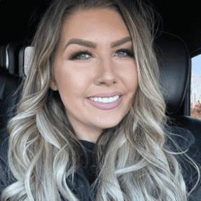 Portrait of Jessica, a professional stylist at Meraki Salon & Spa, showcasing their expertise and style.