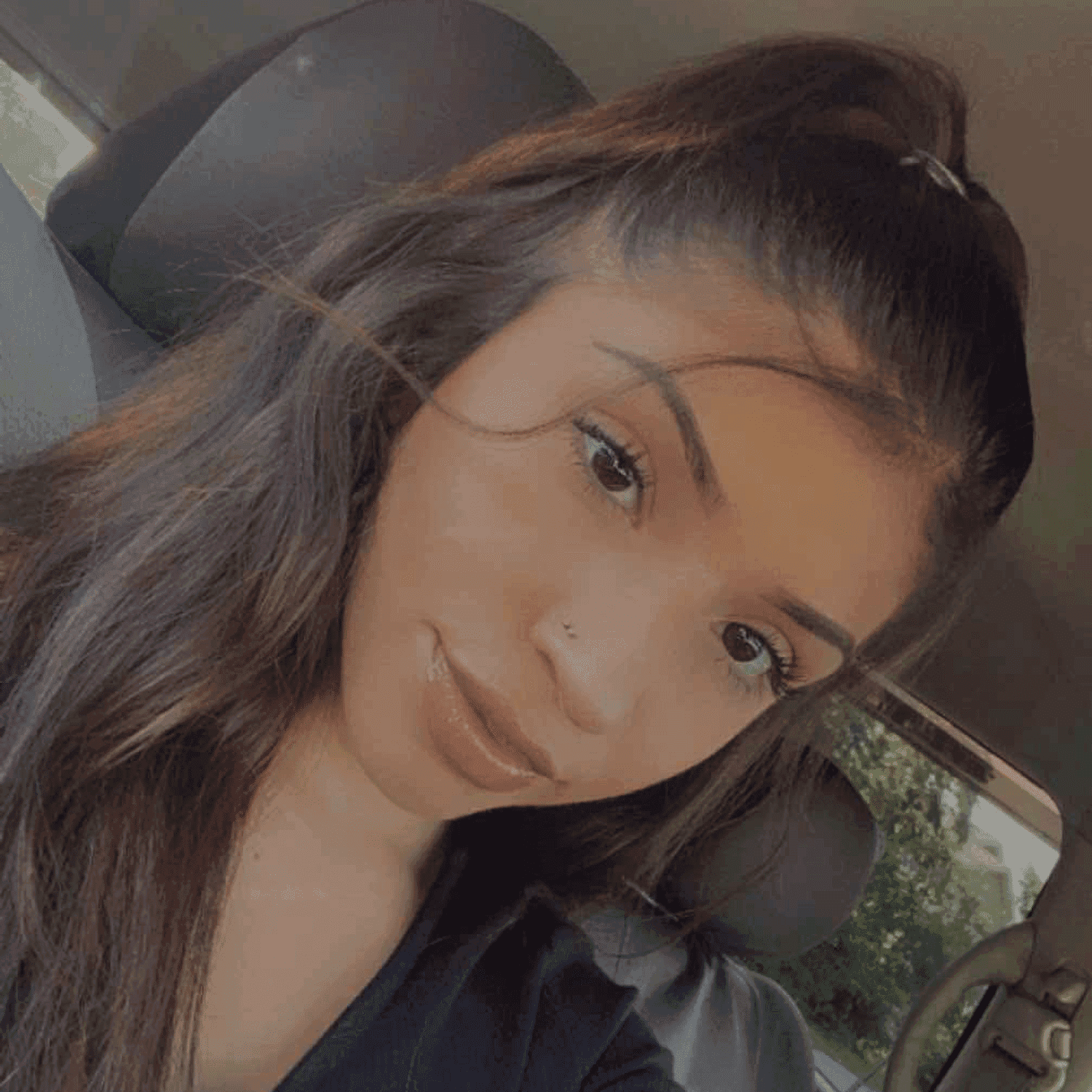 Portrait of Kendra, a professional stylist at Meraki Salon & Spa, showcasing their expertise and style.