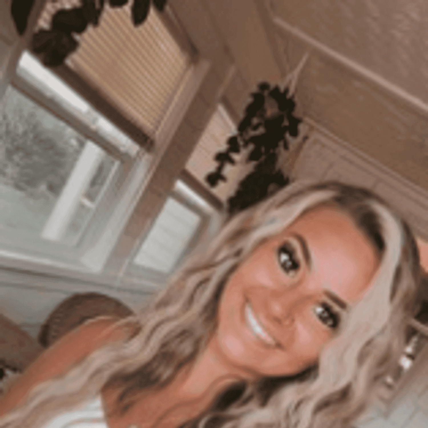 Portrait of Madalyn, a professional stylist at Meraki Salon & Spa, showcasing their expertise and style.