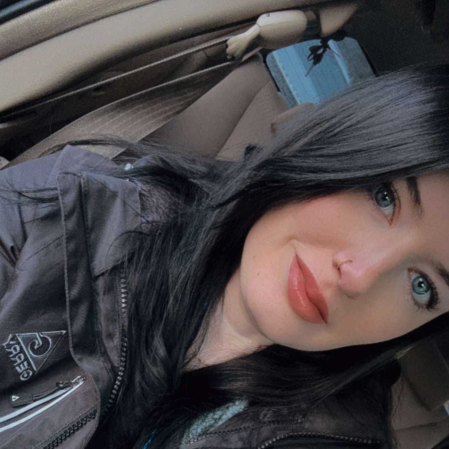 Portrait of Erin, a professional stylist at Meraki Salon & Spa, showcasing their expertise and style.