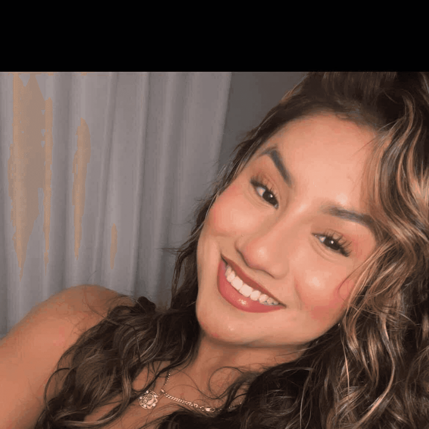 Portrait of Alexa, a professional stylist at Meraki Salon & Spa, showcasing their expertise and style.