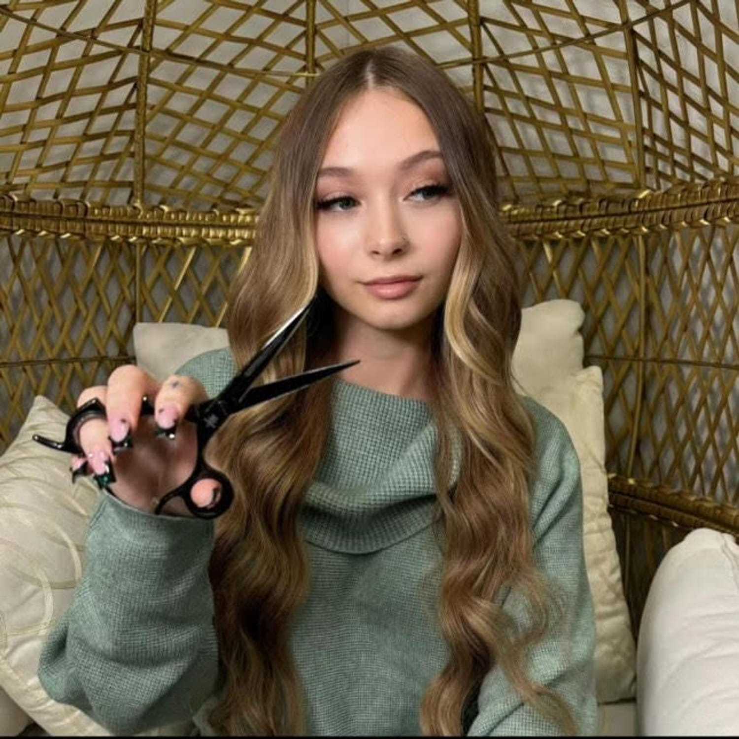 Portrait of Madison, a professional stylist at Meraki Salon & Spa, showcasing their expertise and style.