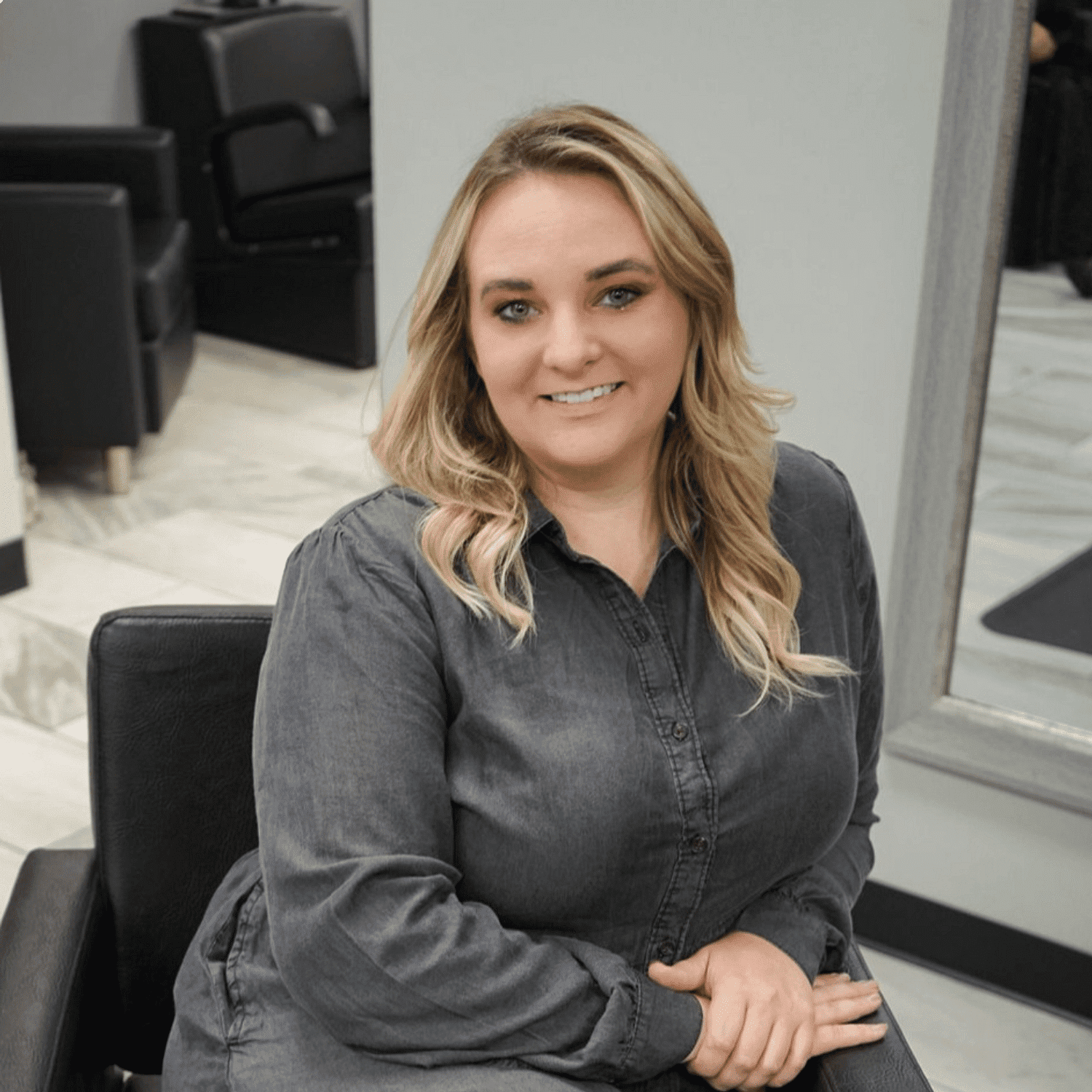 Portrait of Laryssa, a professional stylist at Meraki Salon & Spa, showcasing their expertise and style.
