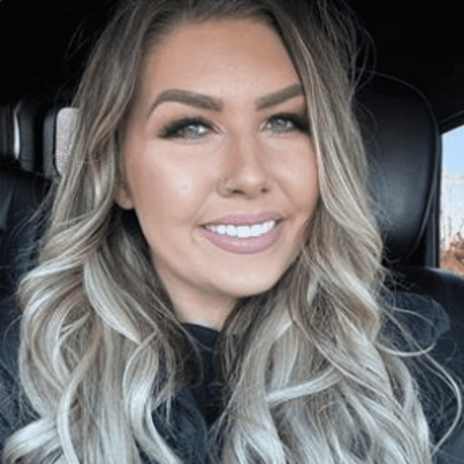 Portrait of Jessica, a professional stylist at Meraki Salon & Spa, showcasing their expertise and style.